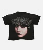 Billionaire Studios Cute Girl Face Logo Tee Black front view Close-up of Cute Girl Face logo on black t-shirt Unisex black streetwear t-shirt styled with jeans Billionaire Studios black tee outfit idea Model wearing Billionaire Studios Cute Girl Face Logo Tee