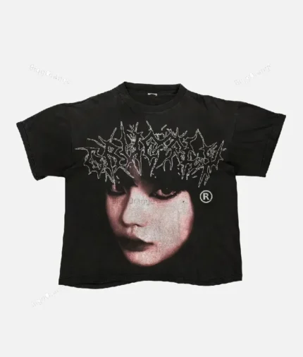 Billionaire Studios Cute Girl Face Logo Tee Black front view Close-up of Cute Girl Face logo on black t-shirt Unisex black streetwear t-shirt styled with jeans Billionaire Studios black tee outfit idea Model wearing Billionaire Studios Cute Girl Face Logo Tee