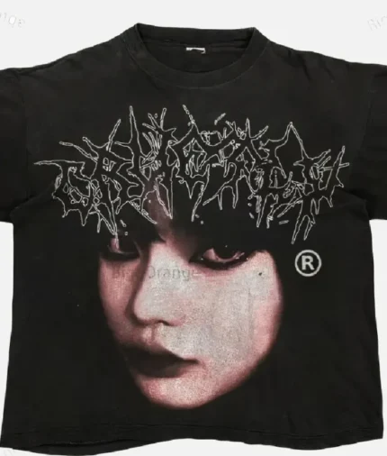 Billionaire Studios Cute Girl Face Logo Tee Black front view Close-up of Cute Girl Face logo on black t-shirt Unisex black streetwear t-shirt styled with jeans Billionaire Studios black tee outfit idea Model wearing Billionaire Studios Cute Girl Face Logo Tee