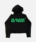 ALT: Billionaire Studios In Glock We Trust Hoodie Black front view ALT: Close-up of “In Glock We Trust” print on hoodie ALT: Model wearing Billionaire Studios black hoodie ALT: Back view of Billionaire Studios oversized hoodie