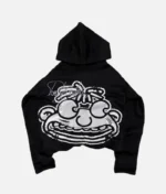 Billionaire Studios Kid Wimpy Hoodie Black front view Back design of Kid Wimpy Hoodie by Billionaire Studios Close-up of Billionaire Studios hoodie logo Comfortable fit – Kid wearing Wimpy Hoodie Black outdoors