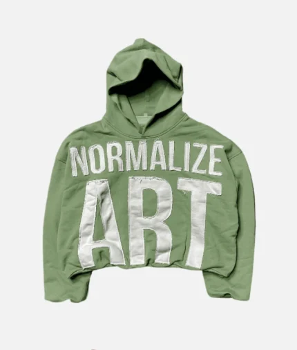Billionaire Studios Normalize Art Hoodie Mossy Front View Normalize Art Graphic Print on Mossy Green Hoodie Side View of Billionaire Studios Hoodie in Mossy Unisex Mossy Art Hoodie Styled with Cargo Pants