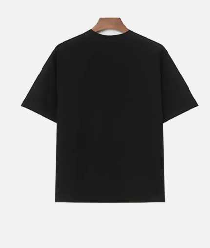 "Front view of Billionaire Studios Saint Difference Tee Black" "Model wearing Billionaire Studios Saint Difference Tee Black streetwear" "Close-up of Saint Difference graphic print on black designer tee" "Back view of Billionaire Studios Black Tee for men"