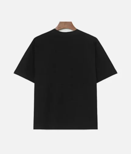 Billionaire Studios Saint Tee Black front view Billionaire Studios Saint Tee premium cotton fabric detail Back side of Billionaire Studios Saint Tee Black Model wearing Billionaire Studios Saint Tee Black with jeans