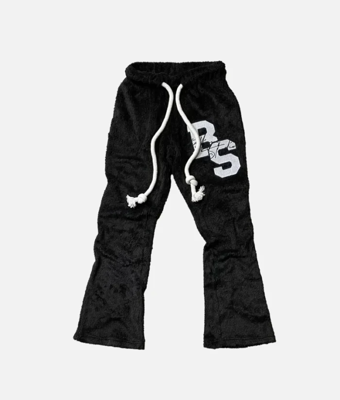 Billionaire Studios Teddy Sweatpants Black front view Billionaire Studios Teddy Sweatpants Black fleece material close-up Model wearing Billionaire Studios Teddy Sweatpants Black streetwear outfit Comfortable fit of Billionaire Studios Teddy Sweatpants Black